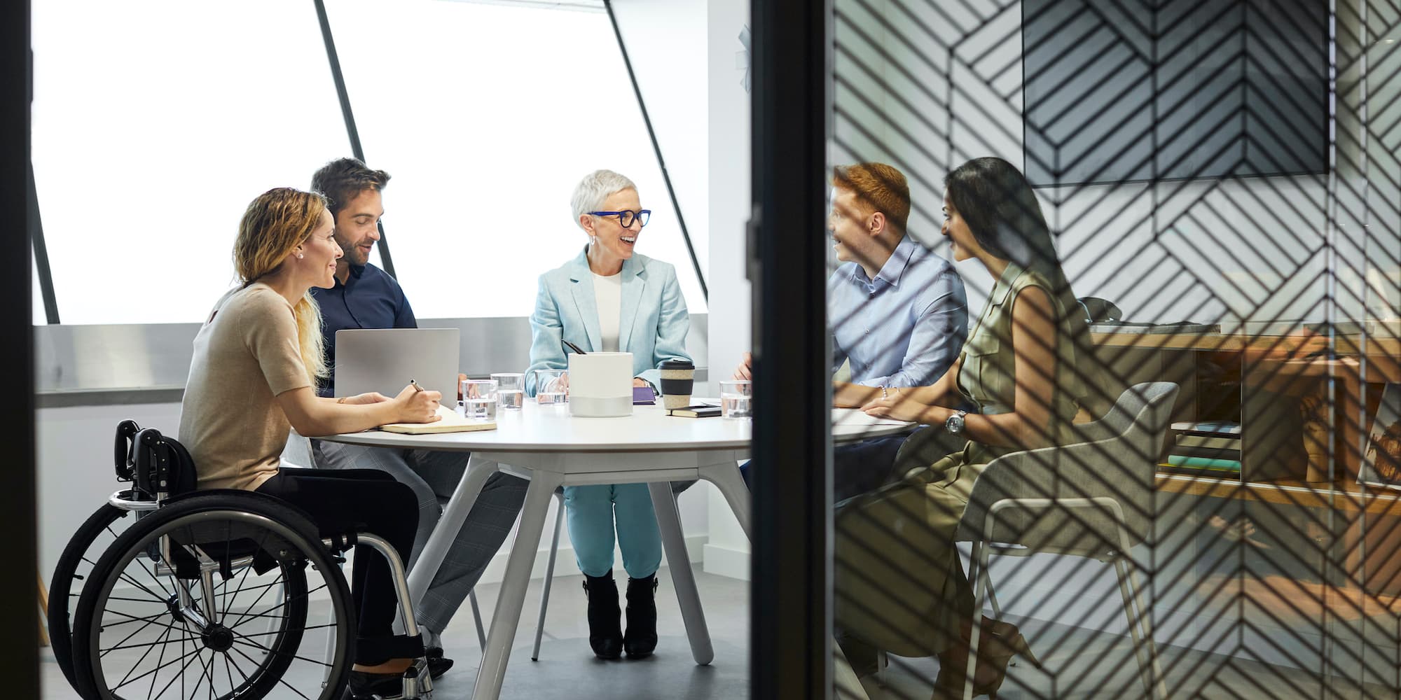 group of people sitting around table at a business meeting