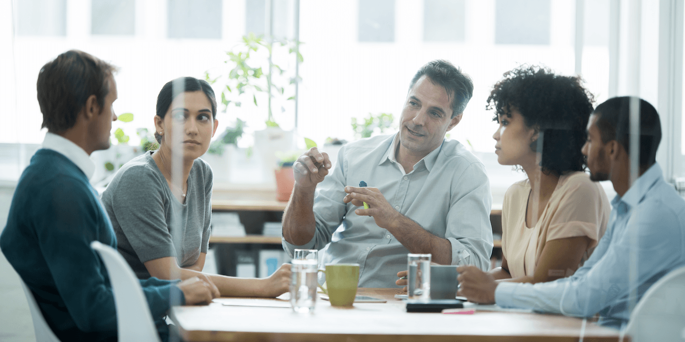 coworkers having a meeting in a conference room