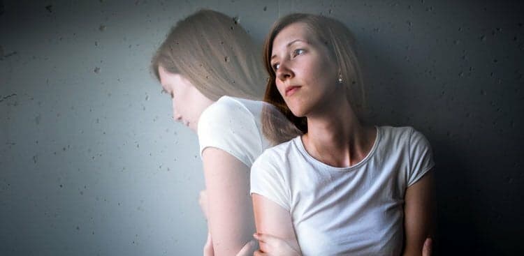 sad person with duplicate image looking to the side