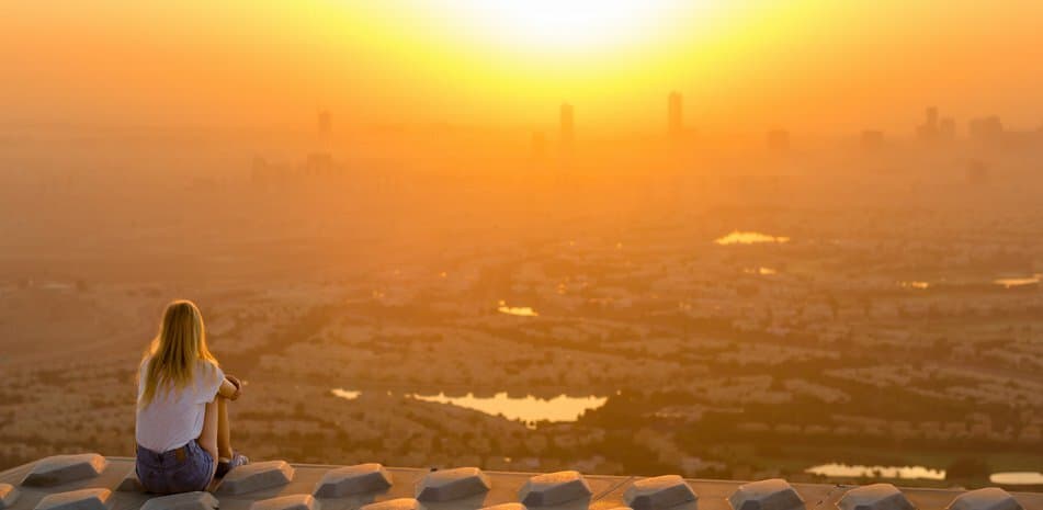person looking at a city view from above