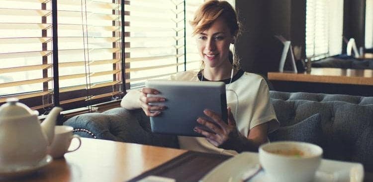woman doing work in a cafe