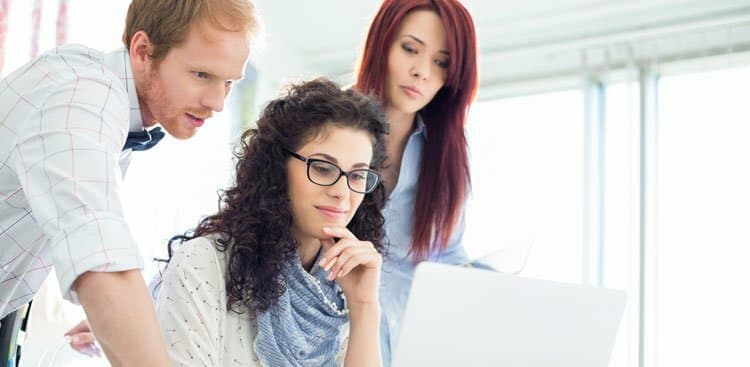 business colleagues using laptop