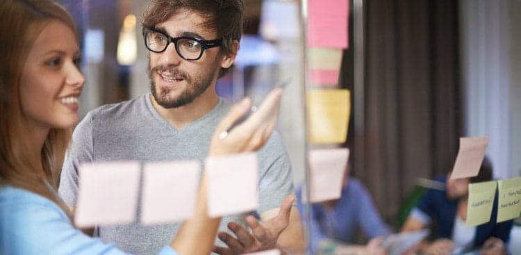 man working with colleague