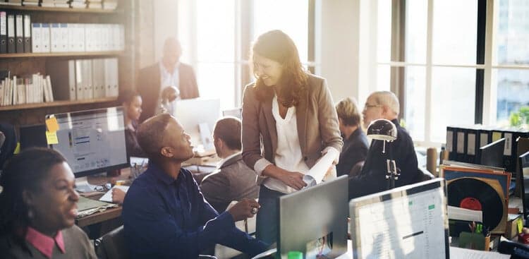 woman talking to team