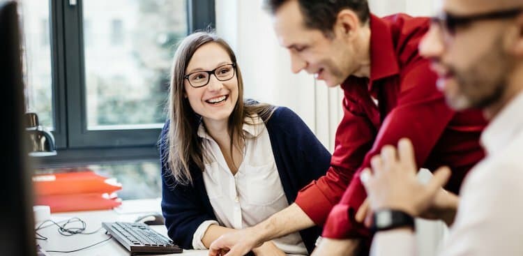 boss and employees talking