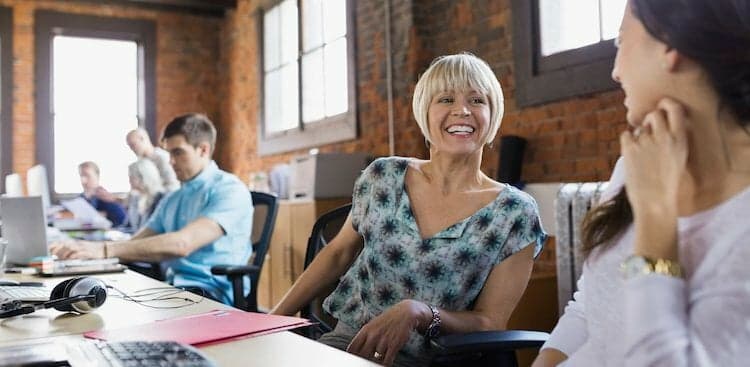 people talking at desk