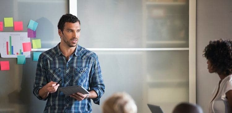 businessman speaking to colleagues