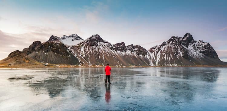 photographer in front of mountains