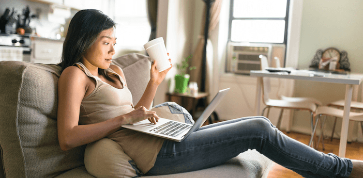 person with laptop on couch