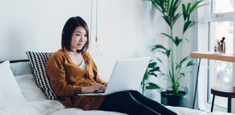 person typing on laptop at home