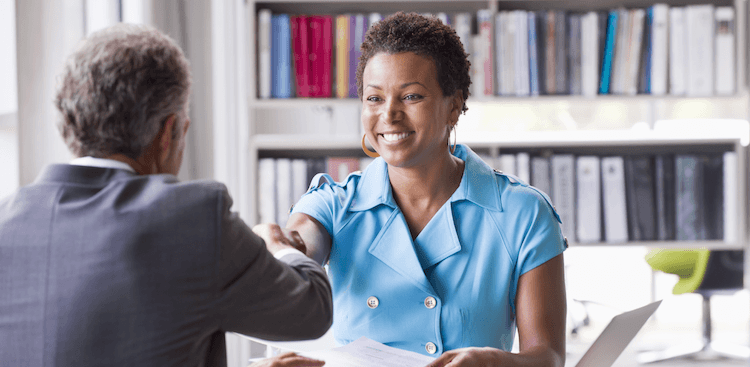 people shaking hands at a job interview