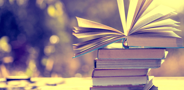 a pile of books on a table