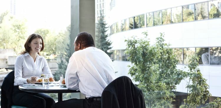 person in interview over a meal