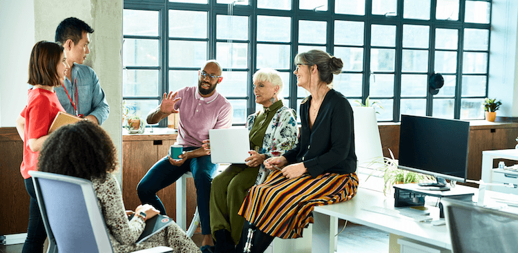 group of co-workers talking in the office