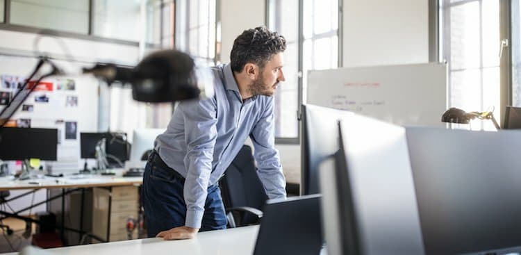 person standing at desk