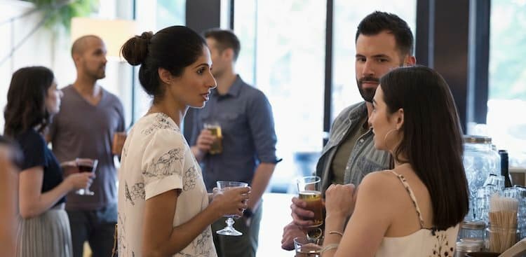 people socializing with drinks