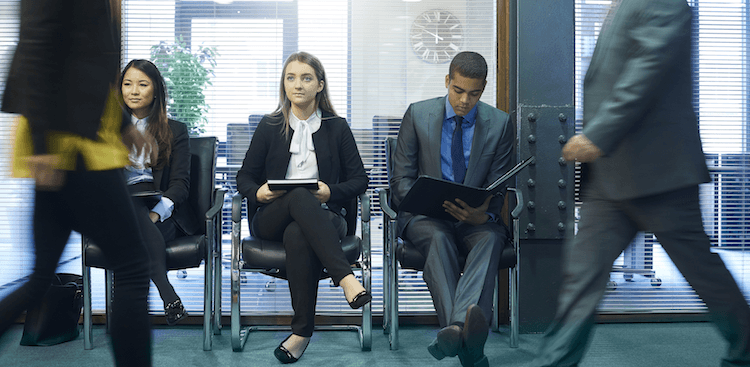 employees sitting in a row in an office