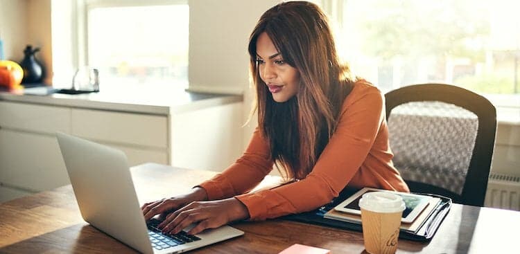 person working from home at kitchen table