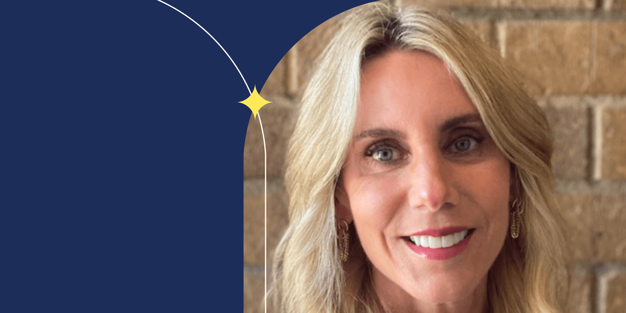 A person facing the camera and smiling. They are wearing pink lipstick and have blonde hair.