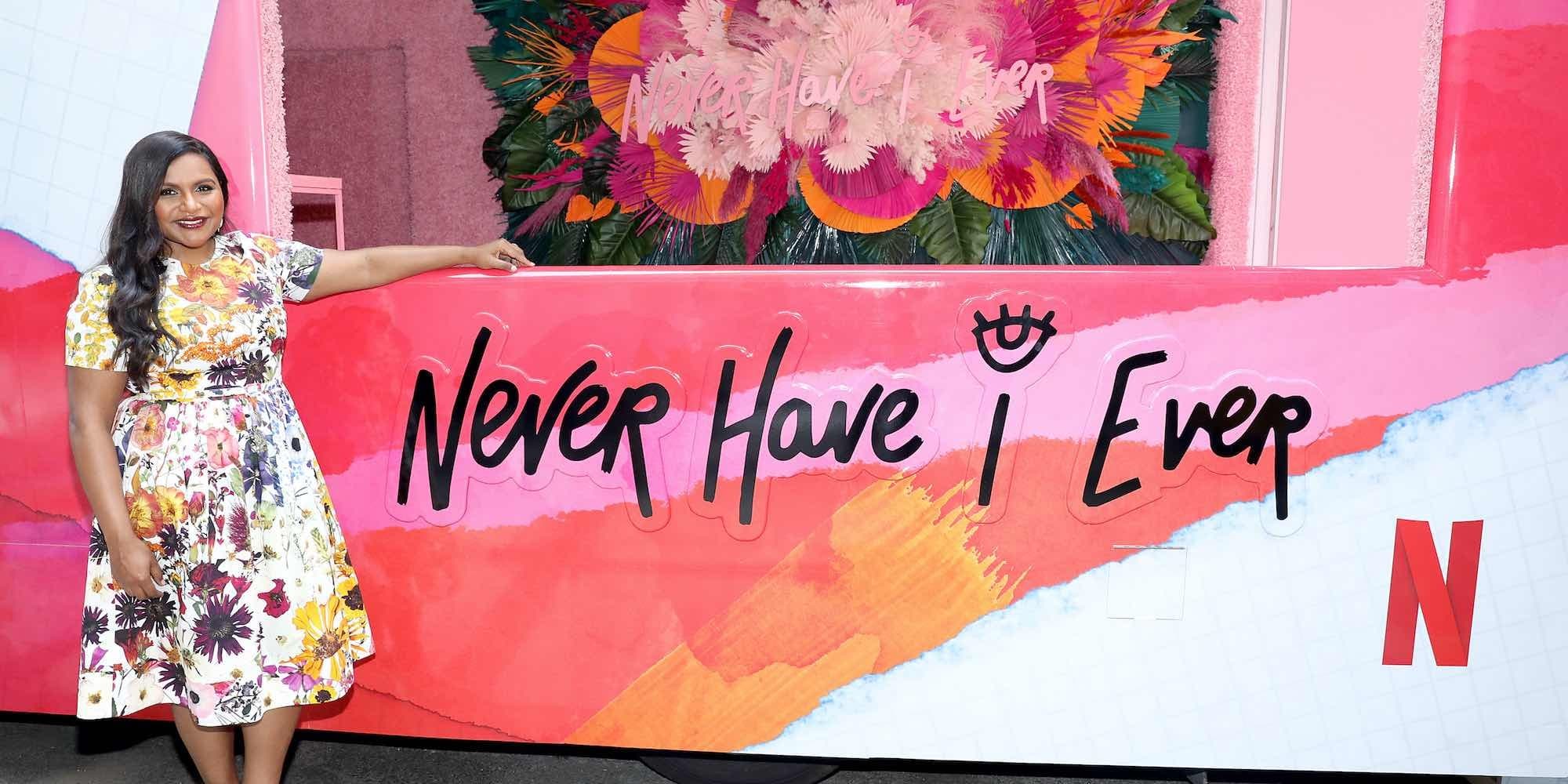 Mindy Kaling stands in front of a Never Have I Ever truck at a pop up celebration for season two in New York City