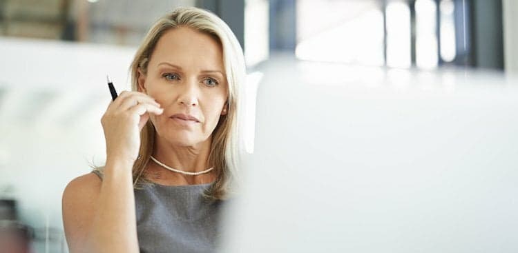 person thinking at desk