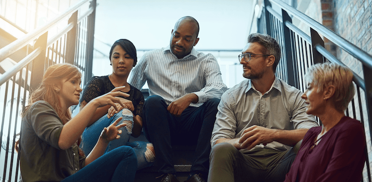 co-workers talking outside the office