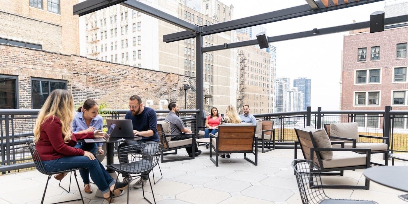 employees working outside in an office patio